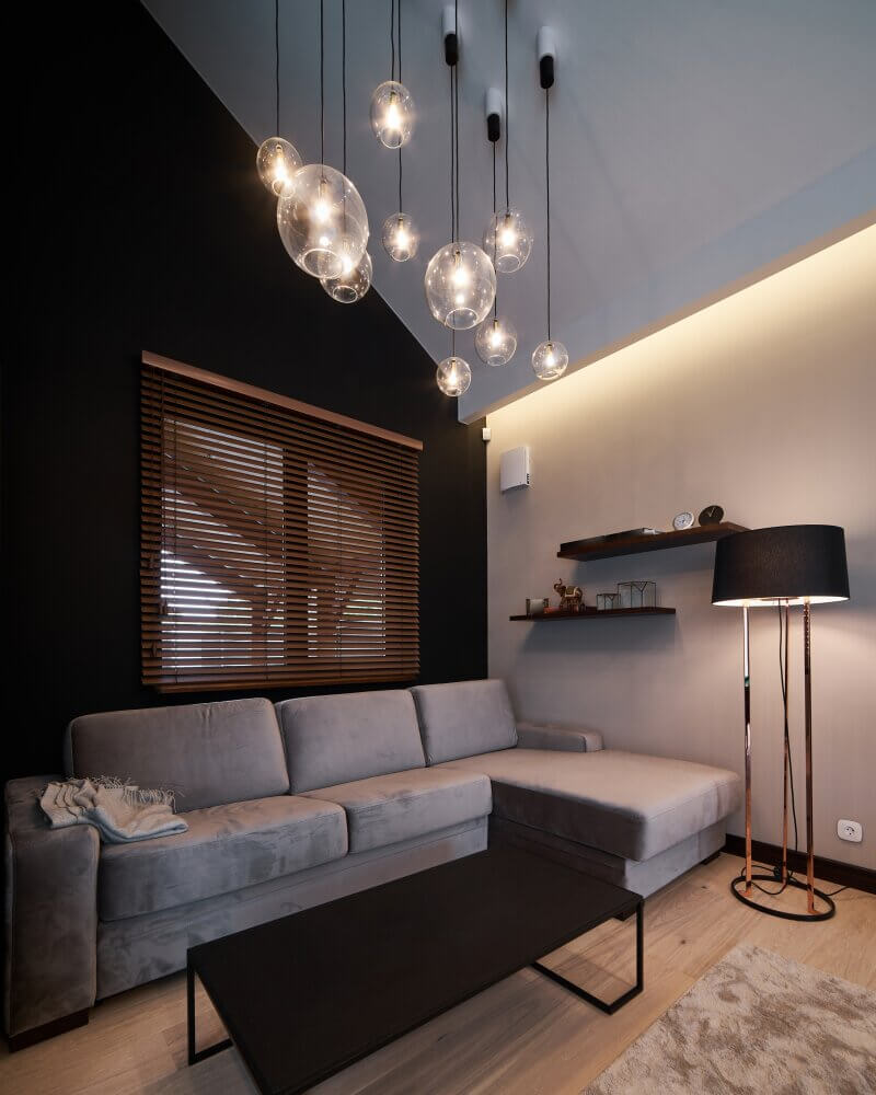 Contemporary living room with pendant lights and warm timber finishes
